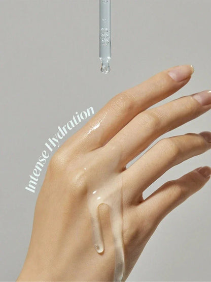 Torriden Dive-In Hyaluronic Acid Serum dripping onto hand for intense hydration